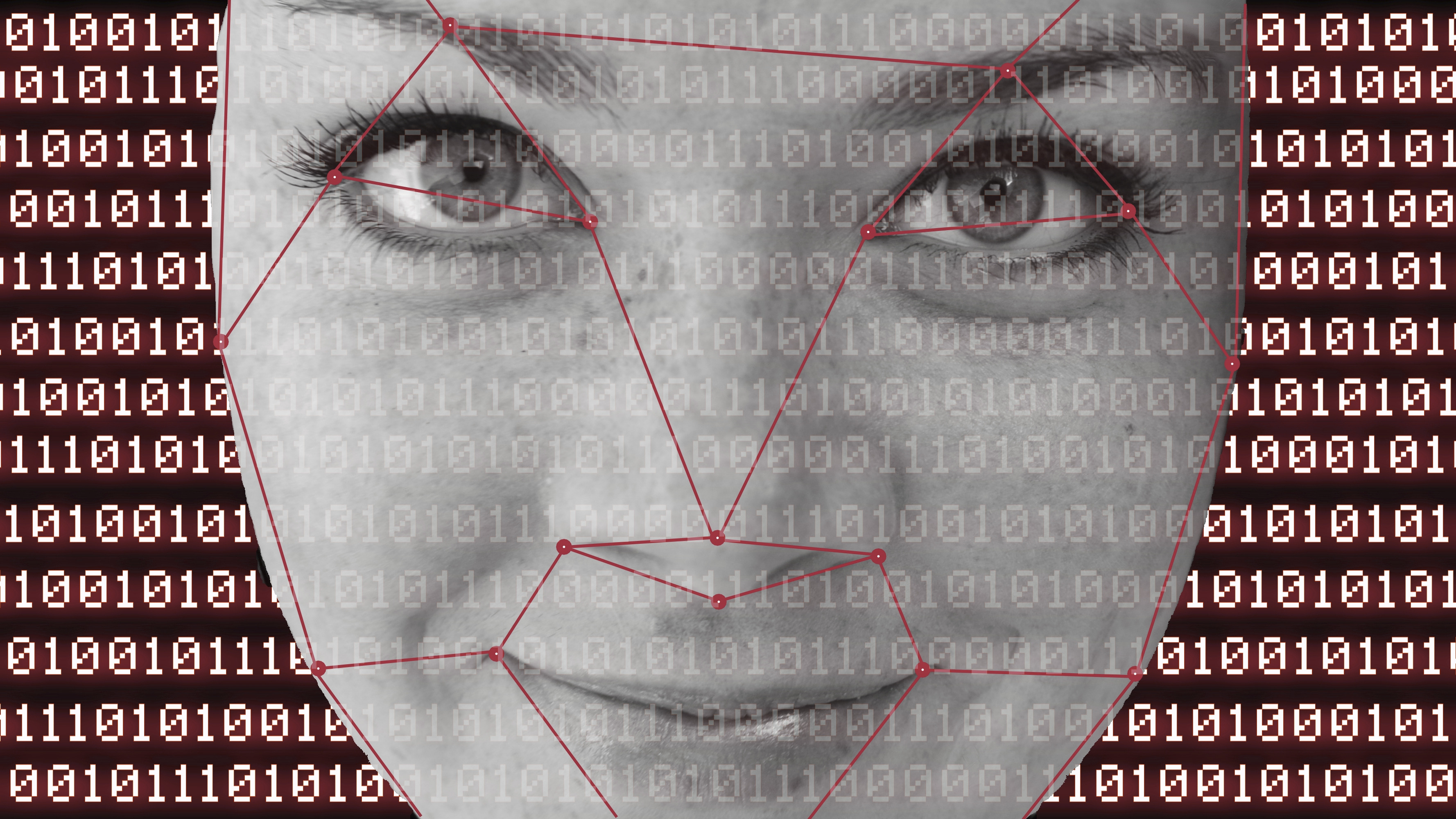 Gros plan sur un visage pâle, sur lequel sont superposés numériquement un code binaire rouge lumineux et des motifs de reconnaissance faciale. L'image évoque l'intelligence artificielle, l'analyse de données et les technologies futuristes — idéale pour des projets liés à la sécurité des données, à la technologie, à la reconnaissance faciale ou aux innovations futures.